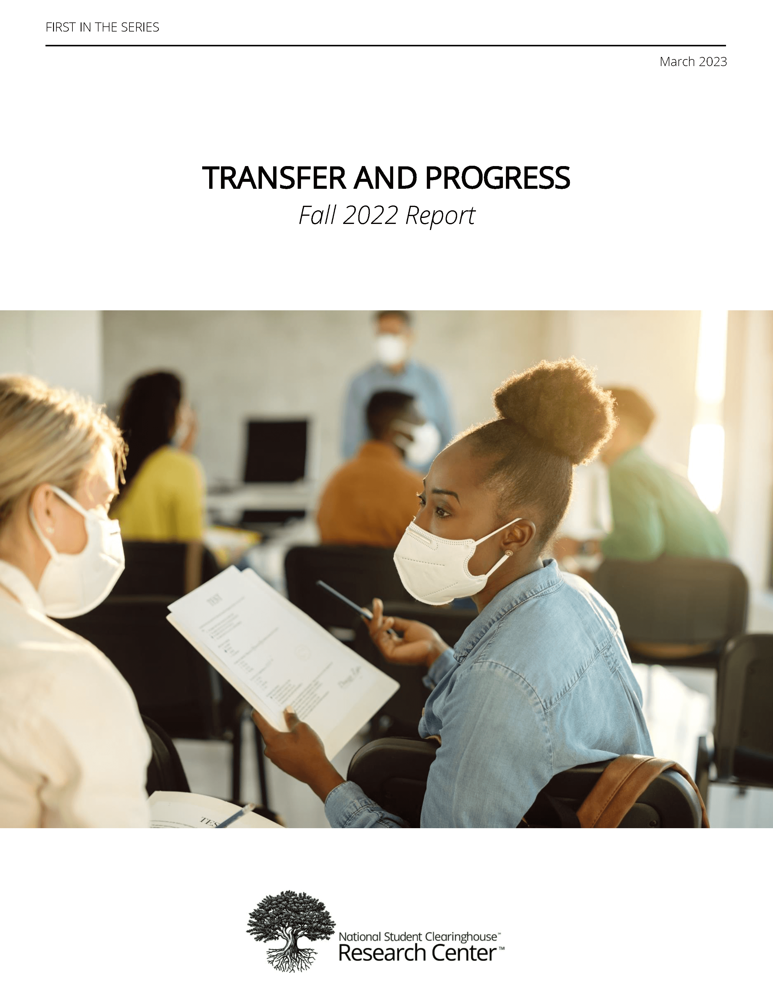 Cover of Transfer and Progress report featuring a photo of two students wearing masks and talking in class.