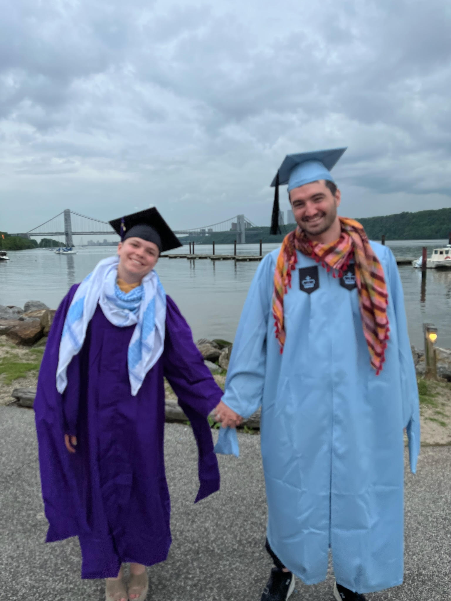 Joe Hille and his partner, Risa smile on graduation day