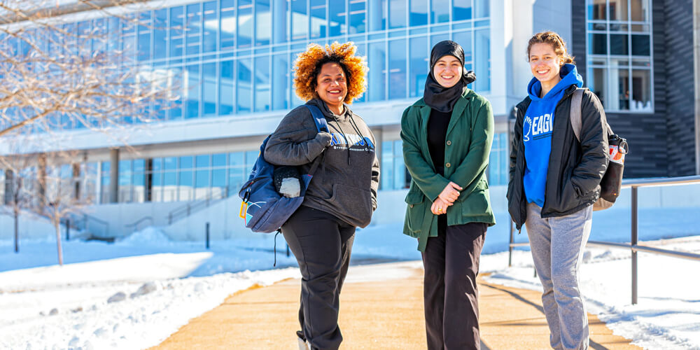 Kirkwood community college students stand in snow