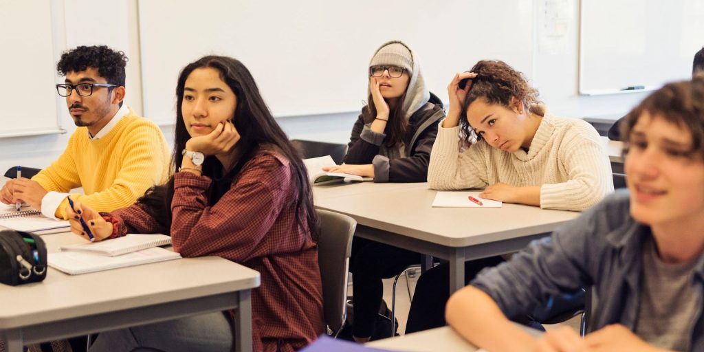 College students in classroom.