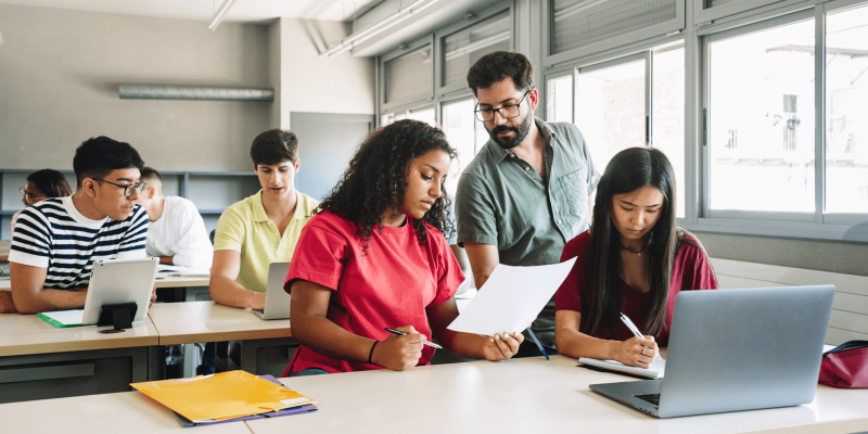 A banner image showing students in a classroom.