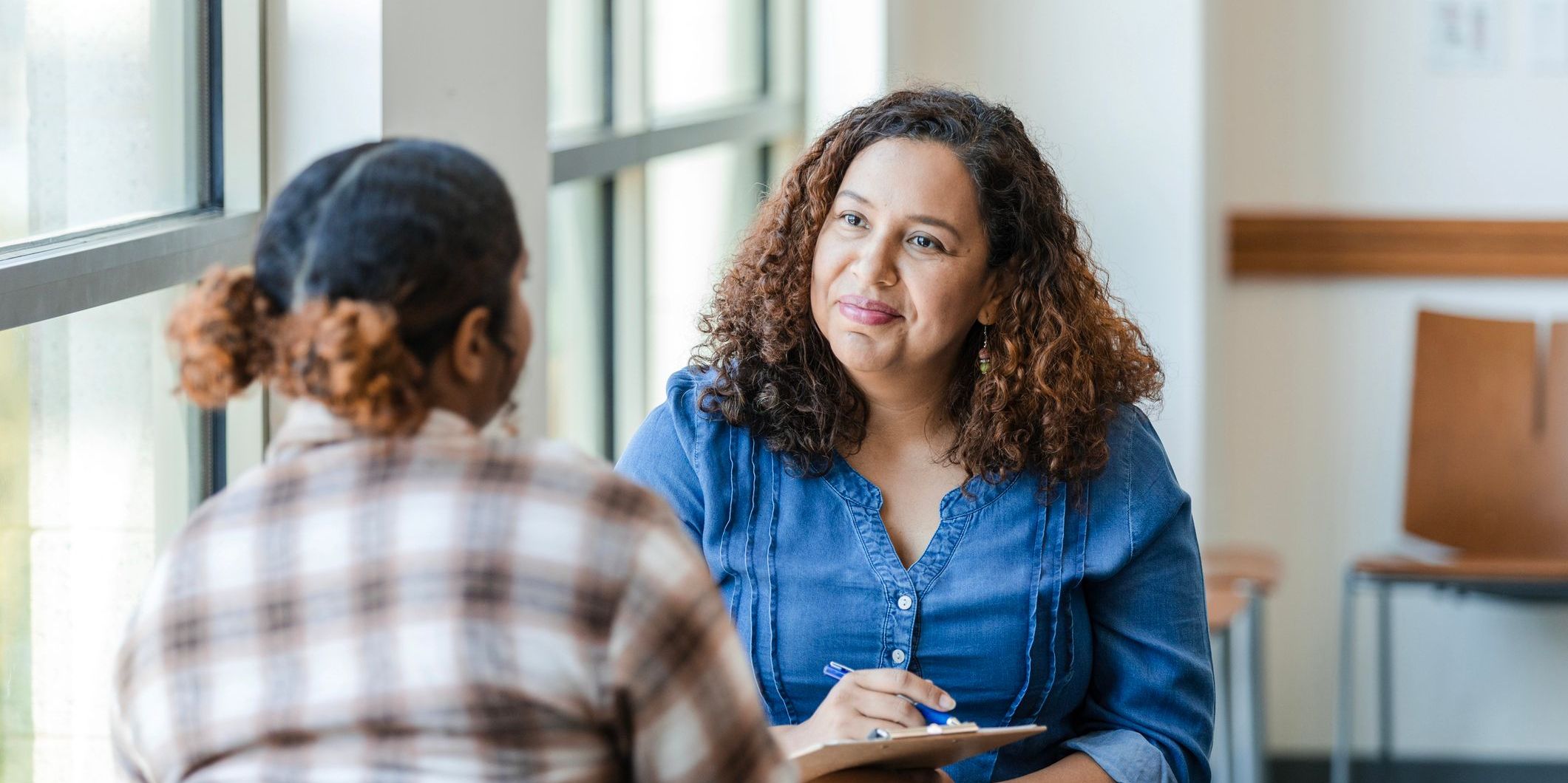 School counselor speaking with student